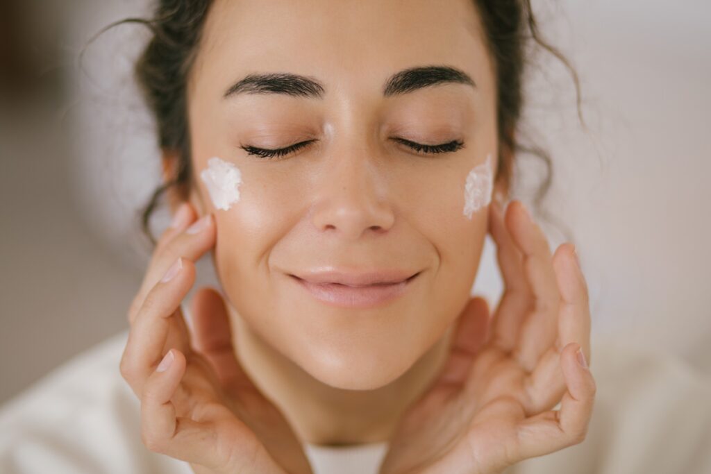 Girl with cream on her face